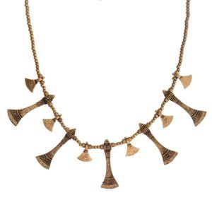 Gold tone beaded necklace with hammered, bohemian charms